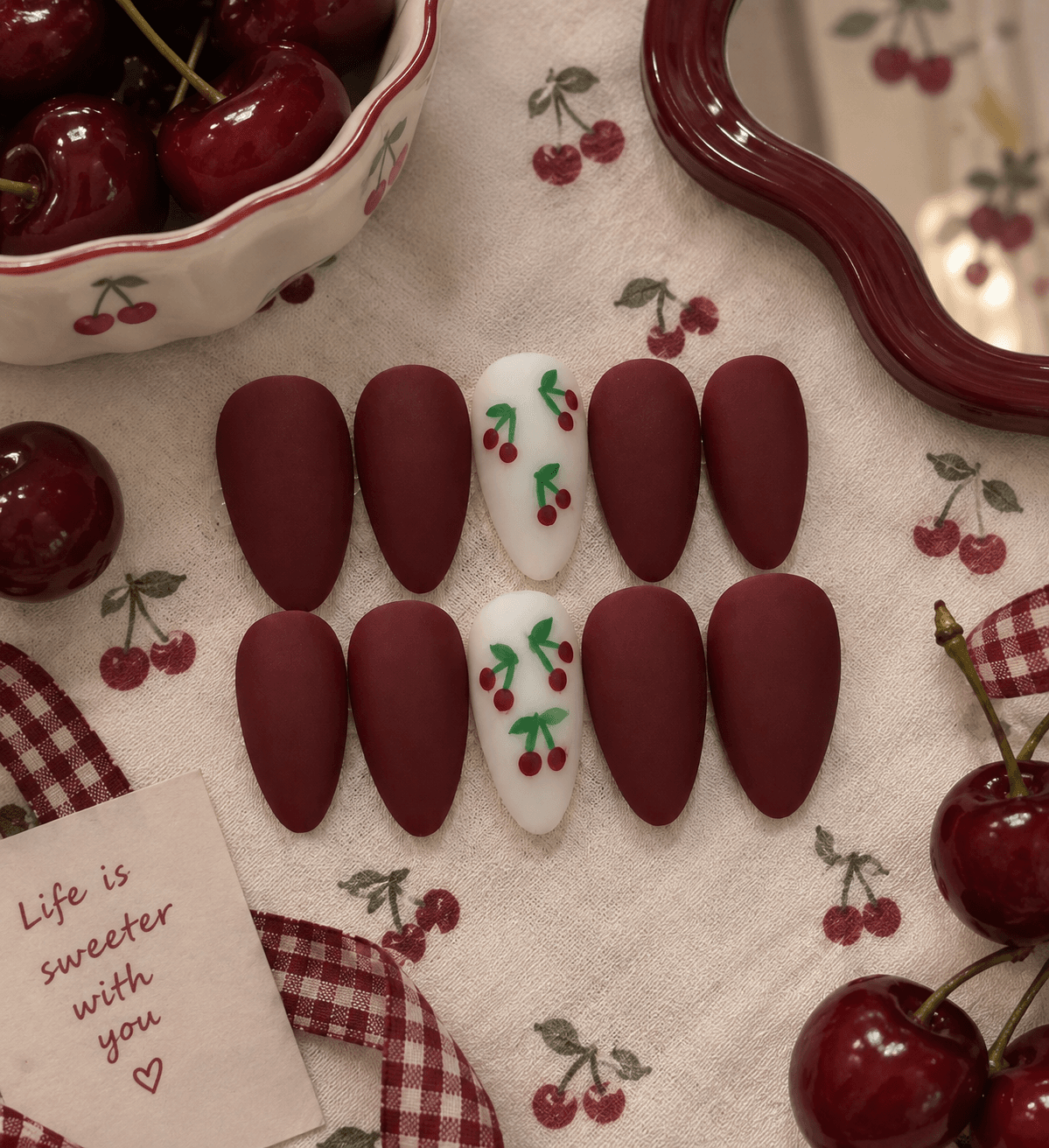 Cherry Cove - L size — Matte cherry-red almond nails with white accent nails and tiny hand-painted cherries.