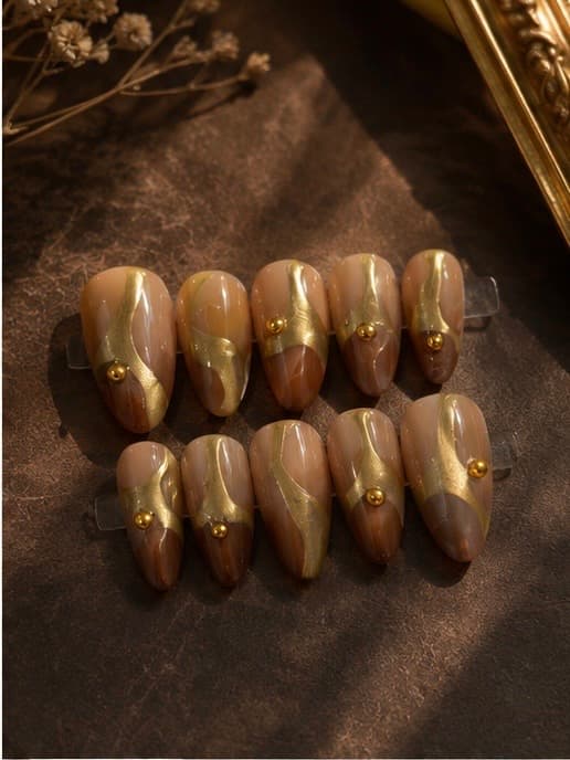 Golden Terrain — Earthy nude and cocoa tones swirled with gold, finished with gold pearl accents