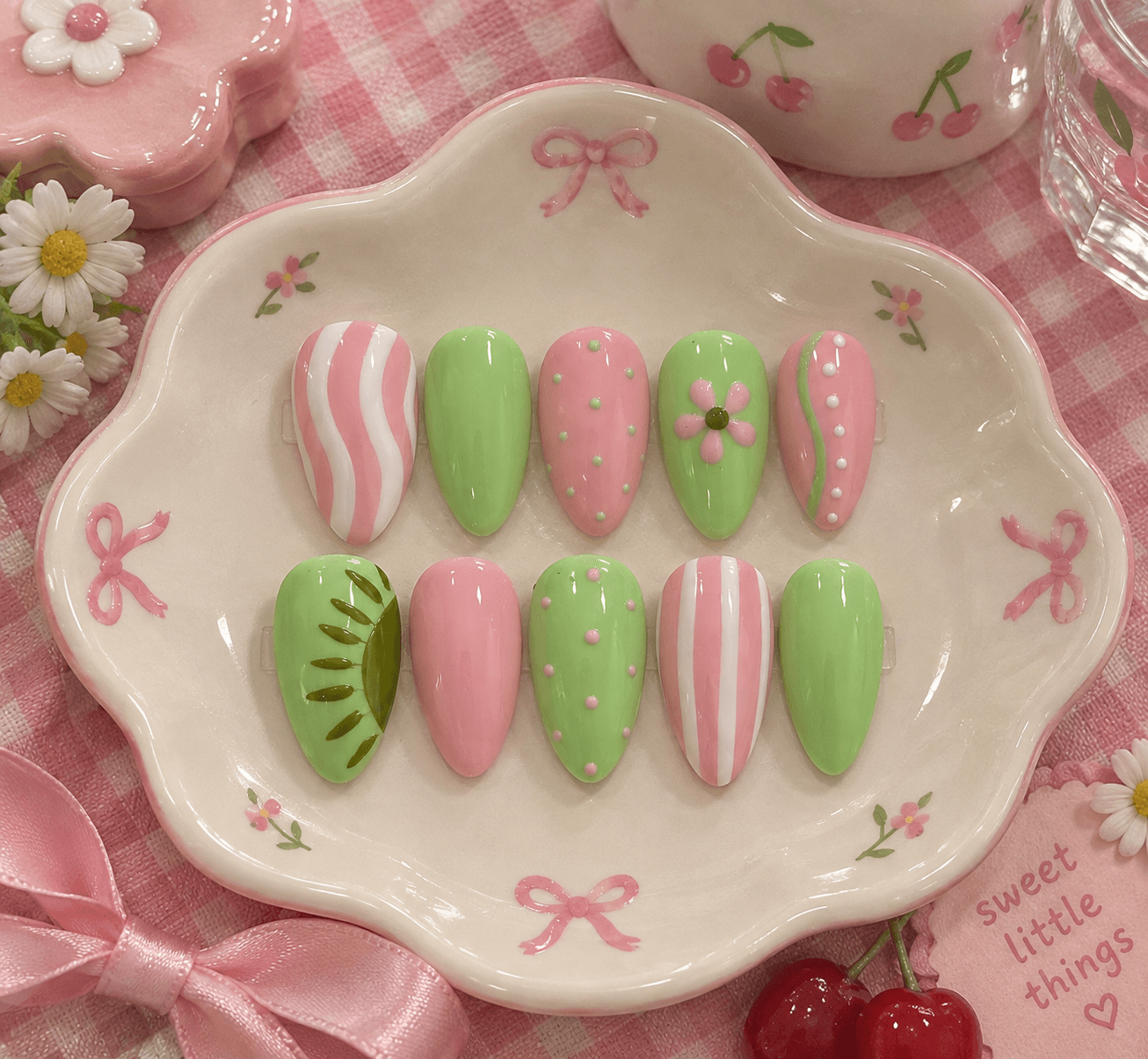 Strawberry Kiwi - L size — Mix-and-match pink and green almond nails with stripes, dots, a daisy, and a kiwi slice.